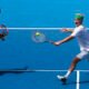 John McEnroe is playing tennis towards a digital model of himself on ESPN+