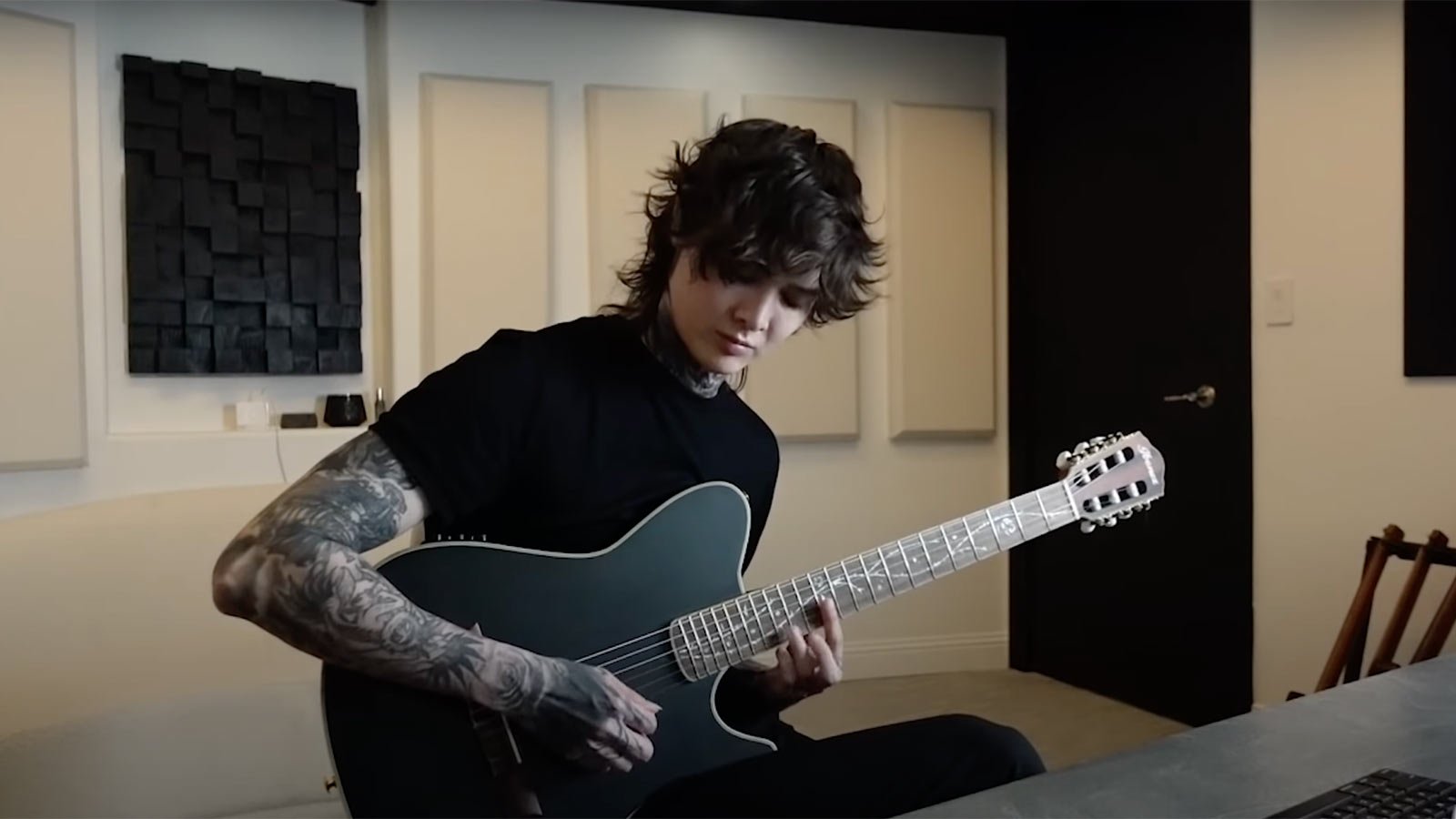 Stare Tim Henson’s flawless unplugged performance of Polyphia’s Taking part in God